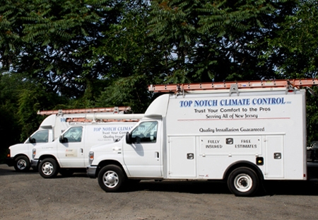 Image of Top Notch Climate Control service trucks.